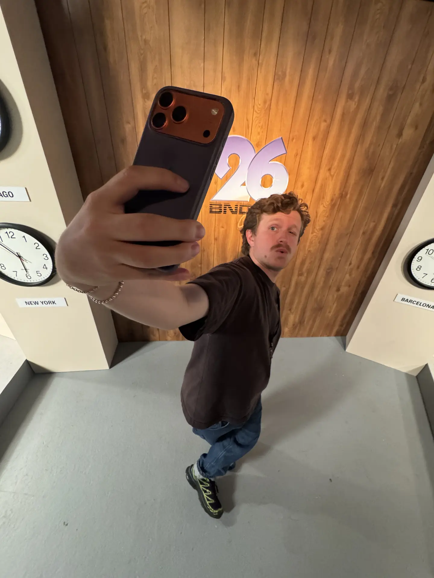 Selfie in front of the Channel 26 logo