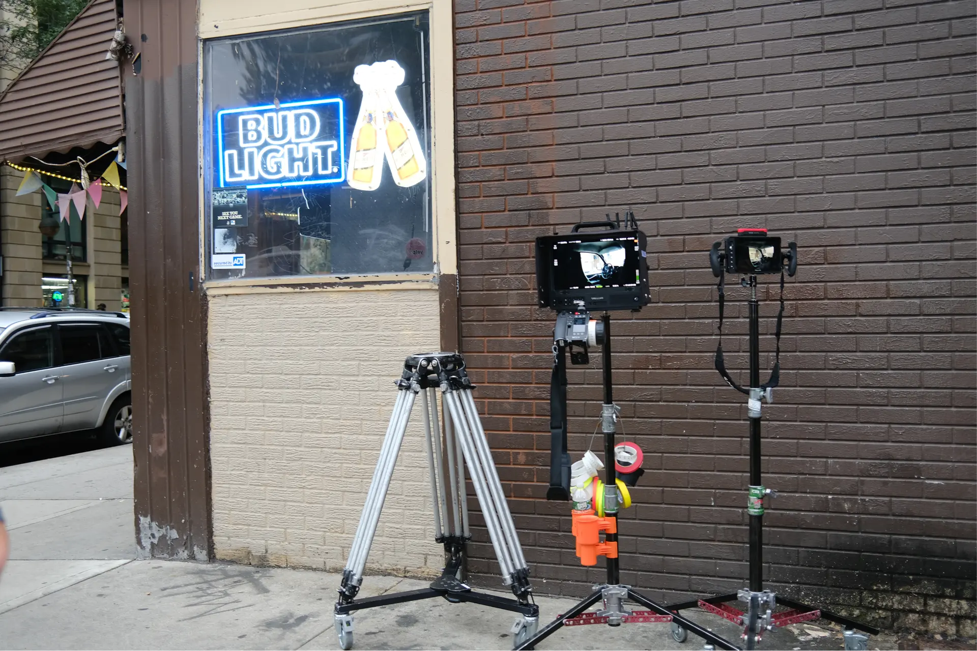 Monitors and tripod outside the bar