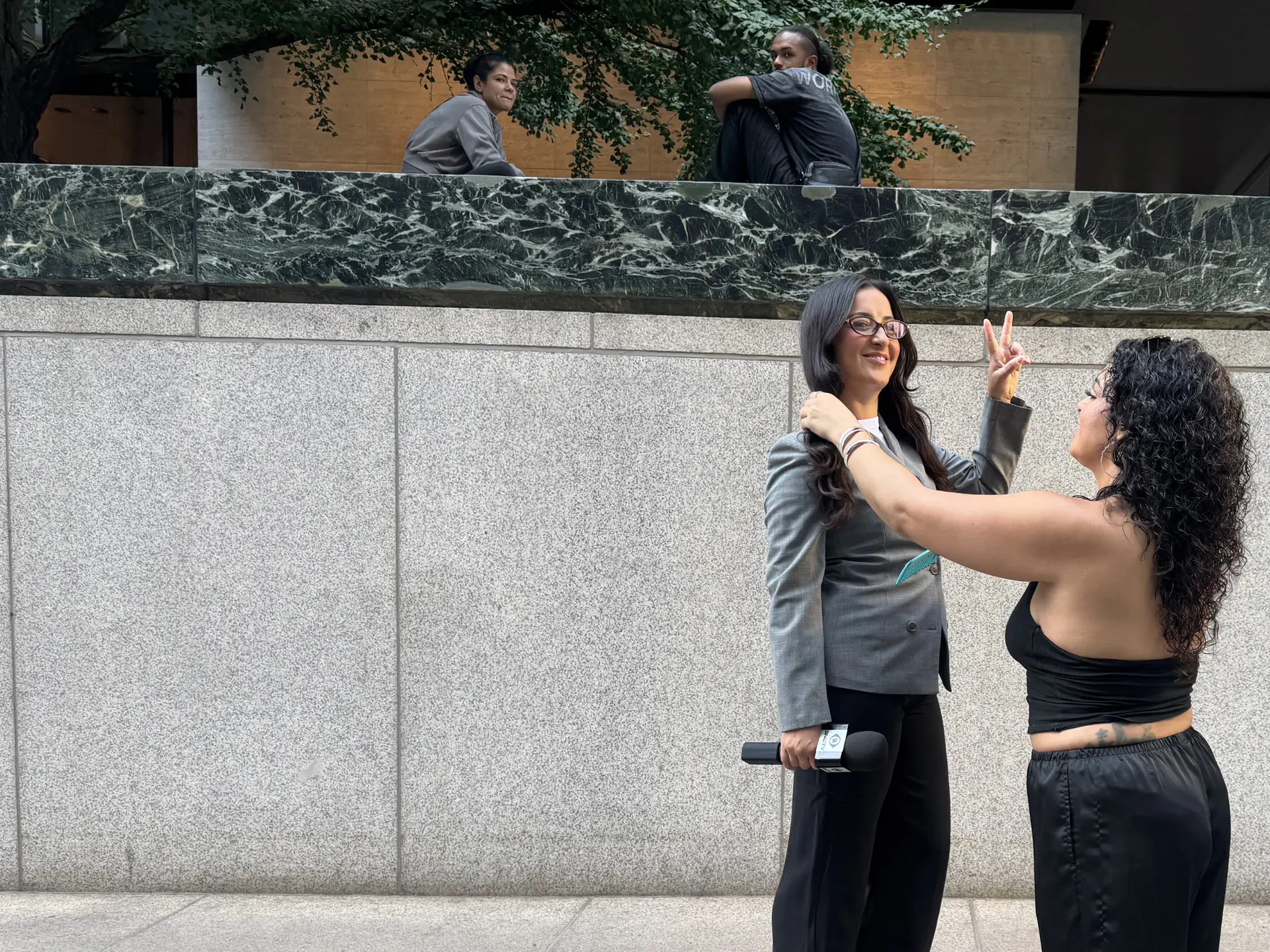 Hair touch-up for the reporter between takes
