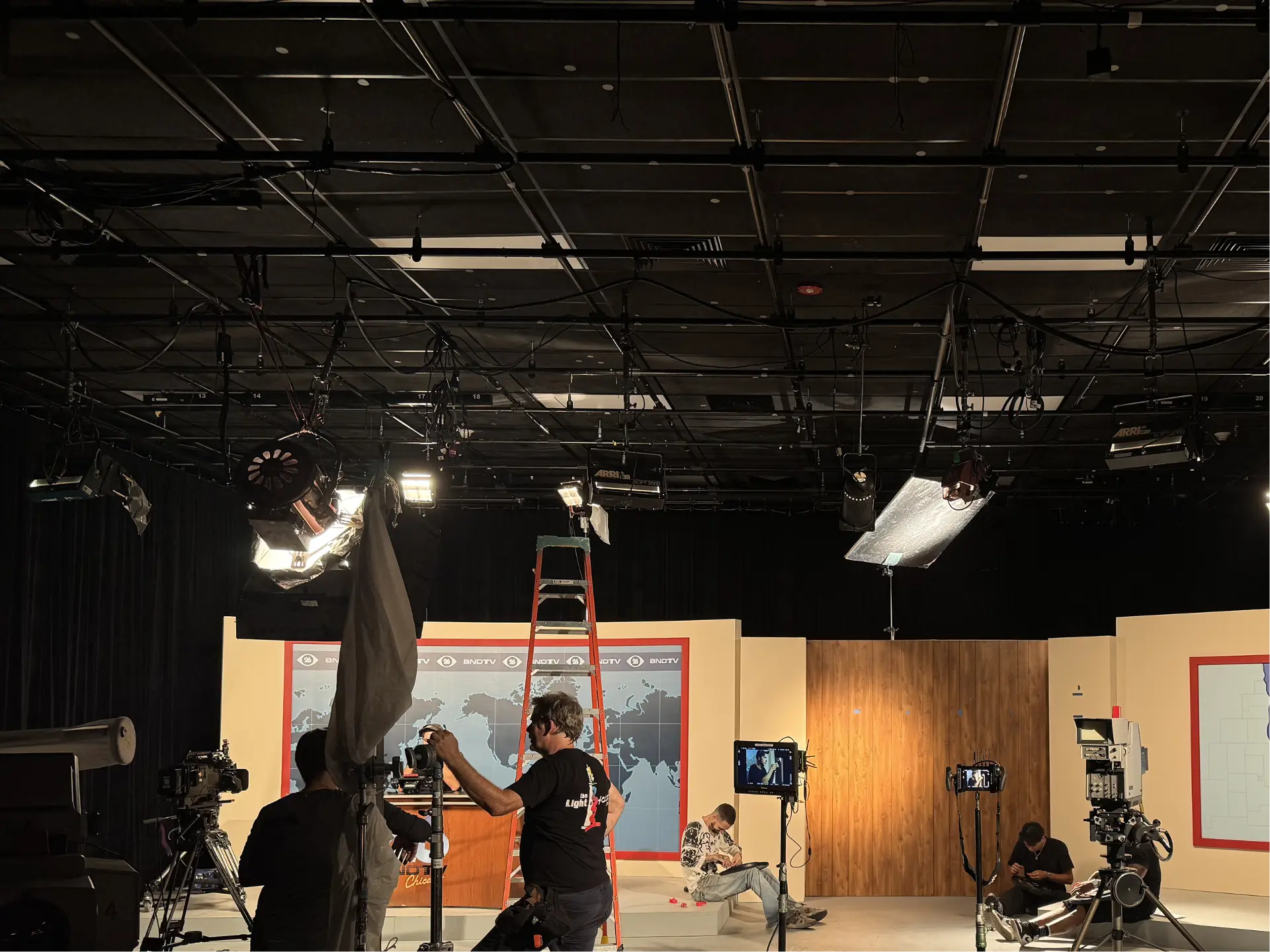 Crew lighting the BNDTV studio set