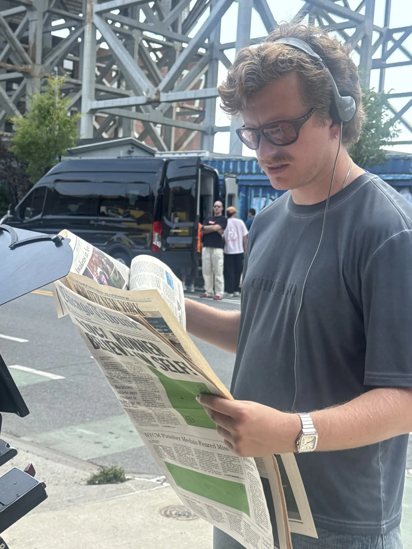 Crew member reading the prop Chicago Tribune