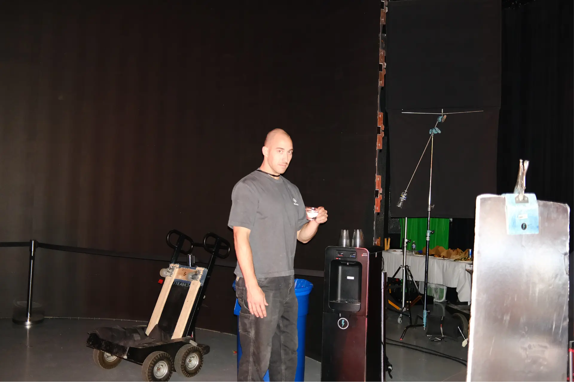 Crew member at the water cooler on set